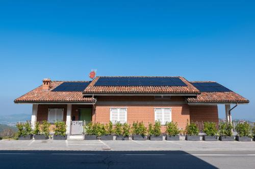 a house with solar panels on the roof at La Villetta Nicolini in Barbaresco