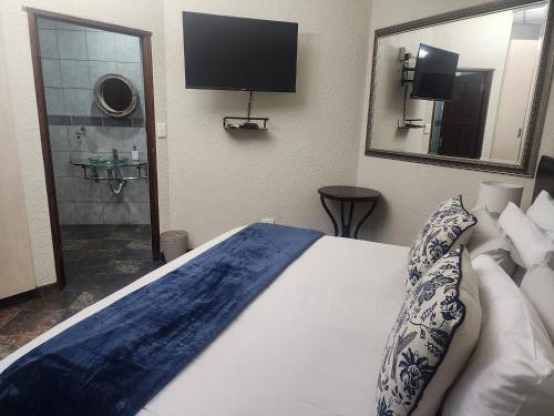 Ένα ή περισσότερα κρεβάτια σε δωμάτιο στο Goodnight Guest Lodge