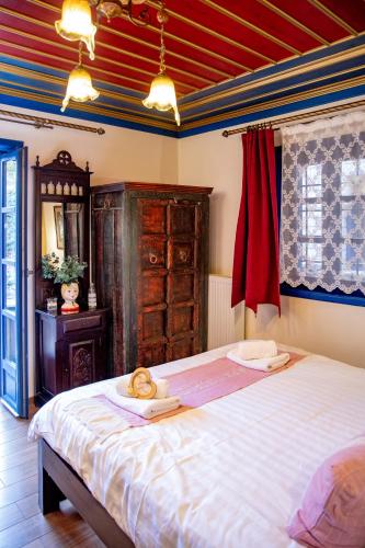 Postel nebo postele na pokoji v ubytování Arktouros Hotel