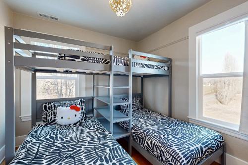 two bunk beds in a room with two beds at The Carroll House in Mosier
