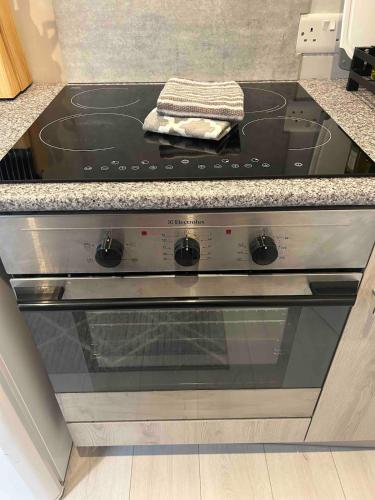 a stove top oven sitting in a kitchen at Coastal Charm and Tranquility in our Studio Guest House in Bournemouth