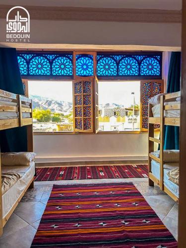 Postel nebo postele na pokoji v ubytování Bedouin Hostel- دار البدوي