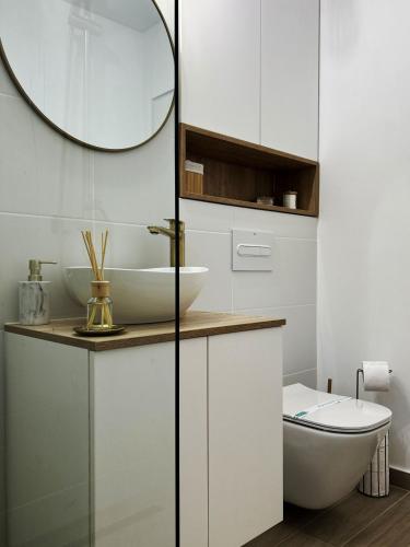 a bathroom with a sink and a mirror at Inga Oasis in Turda