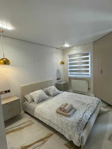 a bedroom with a bed with a tray on it at Los Locos Luxury in Torrevieja