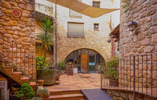 an entrance to a stone building with a staircase at Lovely Home In Vilosell With Wifi in El Vilosell