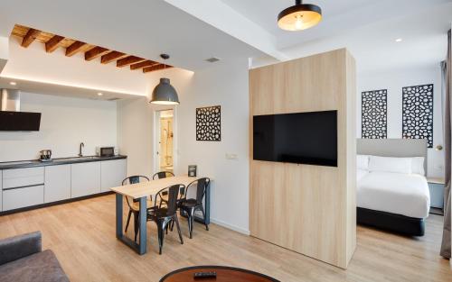 Kuchyň nebo kuchyňský kout v ubytování Sercotel Granada Suites