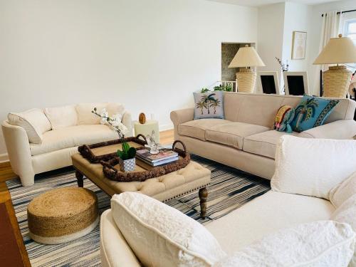 a living room with two couches and a coffee table at Spacious 3 bedroom house 45mins to NYC great hotel alternative for big group in Port Chester