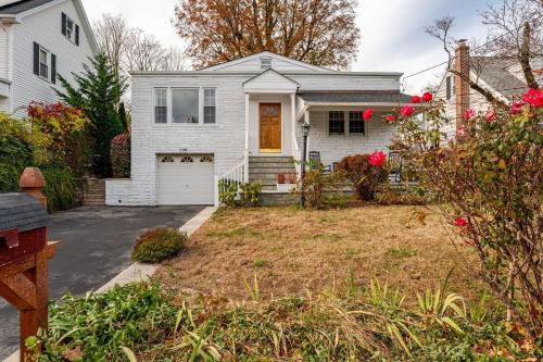 a white house with a yard with a driveway at Spacious 3 bedroom house 45mins to NYC great hotel alternative for big group in Port Chester
