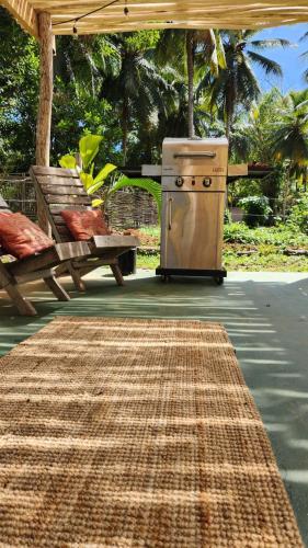 an outdoor area with a grill and a picnic table and a rug at Boho villas and spa in El Valle