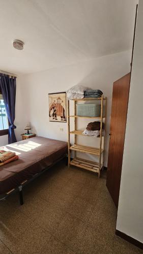 a bedroom with a bunk bed and a shelf at Haus Alegria mit Traumblick in Peniscola