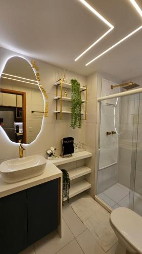 a bathroom with a sink and a shower at Flat Luxo 104A Malia em Muro Alto Porto de Galinhas in Ipojuca