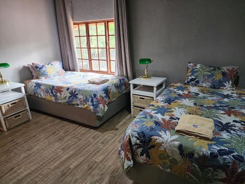 Ένα ή περισσότερα κρεβάτια σε δωμάτιο στο Goodnight Guest Lodge