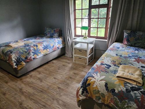 Ένα ή περισσότερα κρεβάτια σε δωμάτιο στο Goodnight Guest Lodge