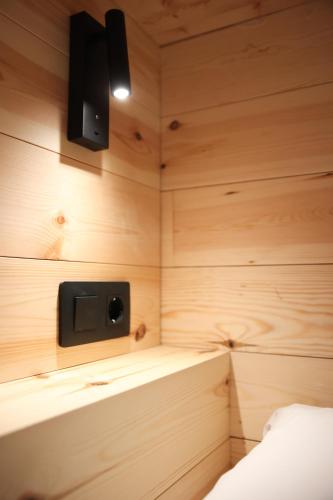 a small room with a speaker on the wall at KY Mountain Hostel Arinsal in Arinsal