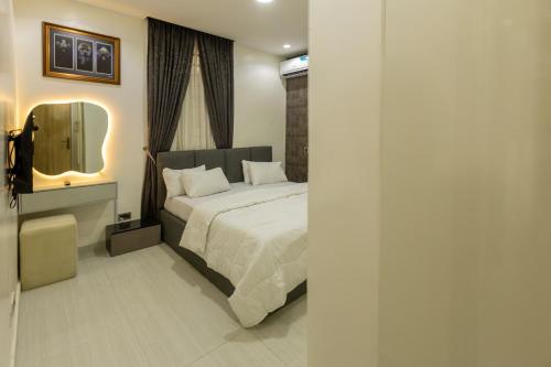 Cama o camas de una habitación en The Delphine in JWC