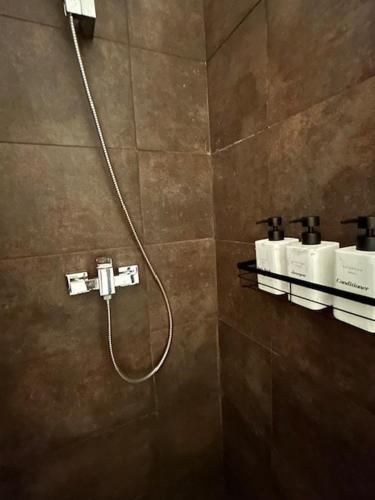 a shower in a bathroom with a shower at Very high standing apartment in Gammarth