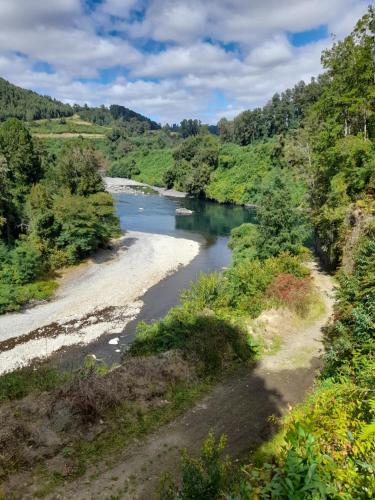 a view of a river from a bridge at cabaña el descanso in Lago Ranco