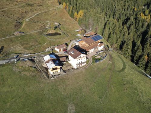 an aerial view of a house in the middle of a field at Ratscheinerhof App Gipfelglück in Lazfons