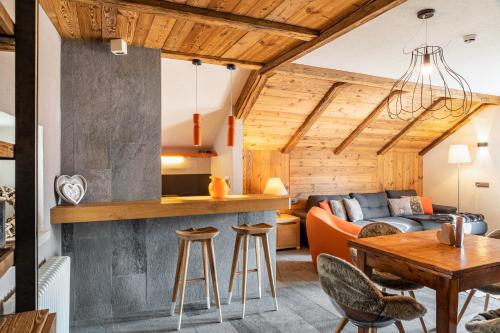 a living room with a couch and a table at Haus Gabriel - Seefeld in Seefeld in Tirol