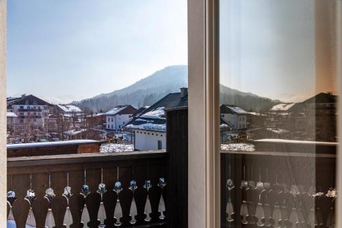 a balcony with a view of a city at Haus Gabriel - Seefeld in Seefeld in Tirol