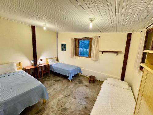 Postel nebo postele na pokoji v ubytování Casa com cachoeiras e contato com a natureza