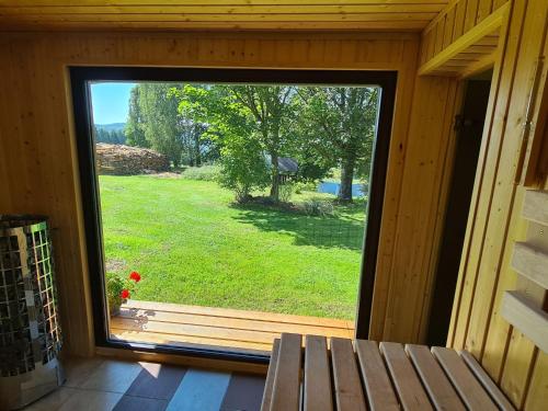 a window in a cabin with a view of a yard at Holiday Home Kralovice by Interhome in Nebahovy