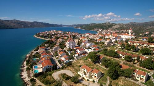 an aerial view of a town next to a body of water at Hotel Viktorija in Seget Vranjica