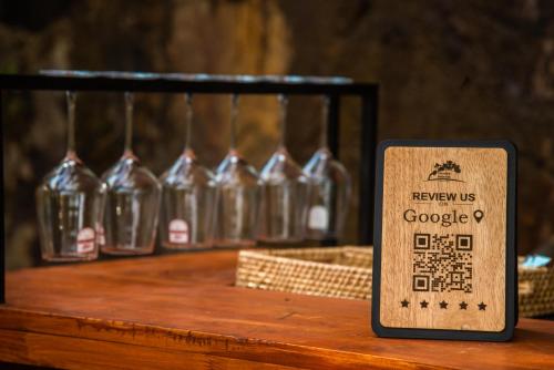 a sign in front of a row of wine bottles at Trance rabara resort in Avissawella