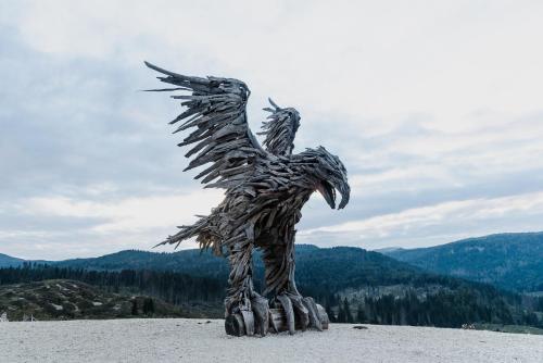 a metal statue of a bird on top of a mountain at Il Fauno in Asiago
