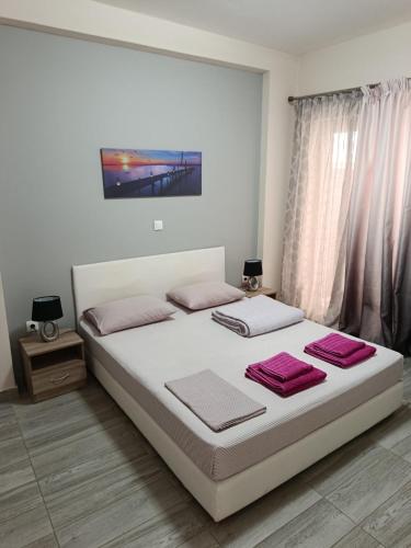 Ένα ή περισσότερα κρεβάτια σε δωμάτιο στο Alimos Apartments