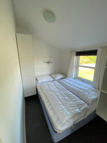 Ένα ή περισσότερα κρεβάτια σε δωμάτιο στο Nymindegab Ridecenter Hytte 5