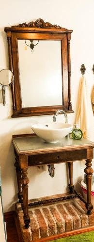 a bathroom with a sink and a mirror at Villa Panorama in Pridraga