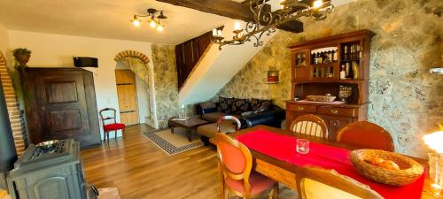 a living room with a table with a red table cloth at Villa Panorama in Pridraga