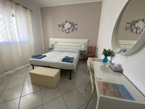 En eller flere senge i et værelse på Casa vacanza *Villa Marchesina*