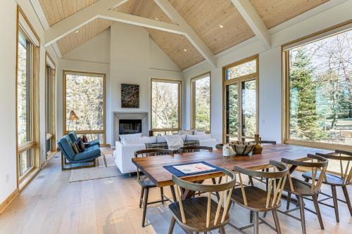 a living room with a table and chairs at Green Lake Getaway with Dock Boating and Swimming! in Markesan