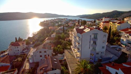 an aerial view of a town next to the water at Hotel Viktorija in Seget Vranjica