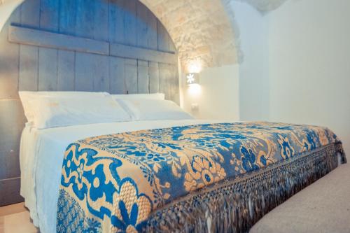 Posteľ alebo postele v izbe v ubytovaní Navolte Trulli e Quiete con Piscina