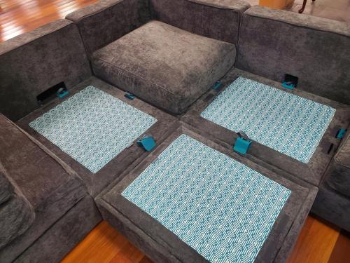 an overhead view of a couch with four pillows at Spooky Nook Bed and Breakfast in Manheim