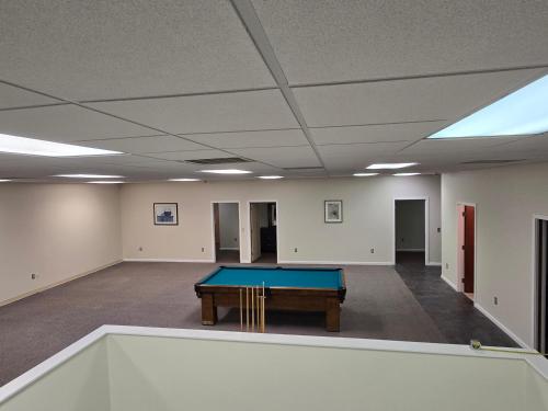 an empty room with a ping pong table in it at Spooky Nook Bed and Breakfast in Manheim