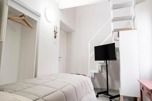 a bedroom with a bed and a staircase at Bed & Breakfast AL 171 in Velletri