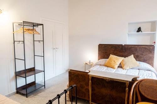 a bedroom with a bed and a book shelf at Bed & Breakfast AL 171 in Velletri