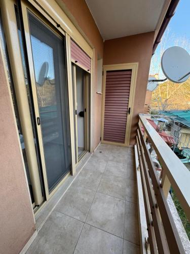 a walkway outside of a home with glass doors at Vesanos Mezonet in Toroni