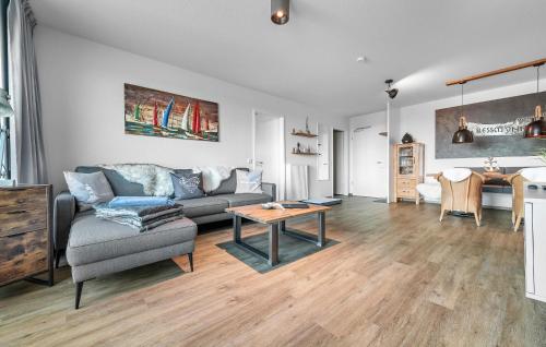 a living room with a couch and a table at Slessmynna in Kappeln