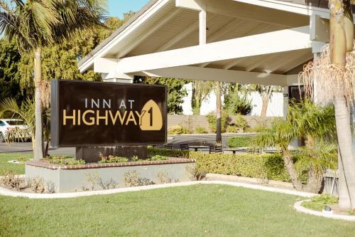 a sign that reads im at highway at Inn at Highway 1 in Lompoc