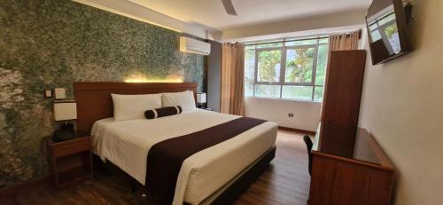 Postel nebo postele na pokoji v ubytování Hotel Ferré Machu Picchu