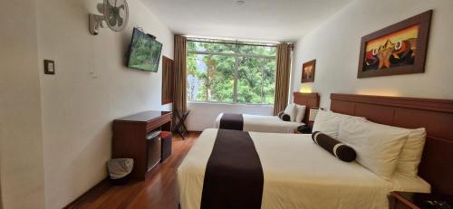 Postel nebo postele na pokoji v ubytování Hotel Ferré Machu Picchu