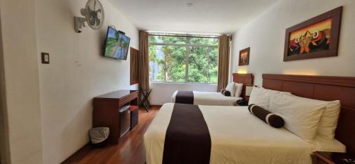 Postel nebo postele na pokoji v ubytování Hotel Ferré Machu Picchu