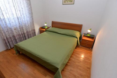 Postel nebo postele na pokoji v ubytování Apartments Slavica 590