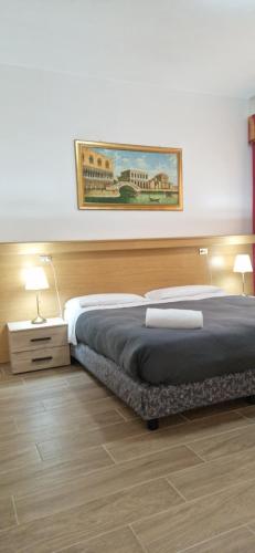 Postel nebo postele na pokoji v ubytování Hotel Tito