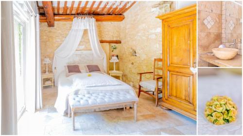 une chambre avec un lit à baldaquin dans l'établissement Mas des Agranas, à Sénas